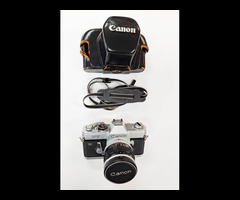 23. Canon FT QL 35mm Film Camera with a Canon 58mm f/1.2 Lens in a leather case.